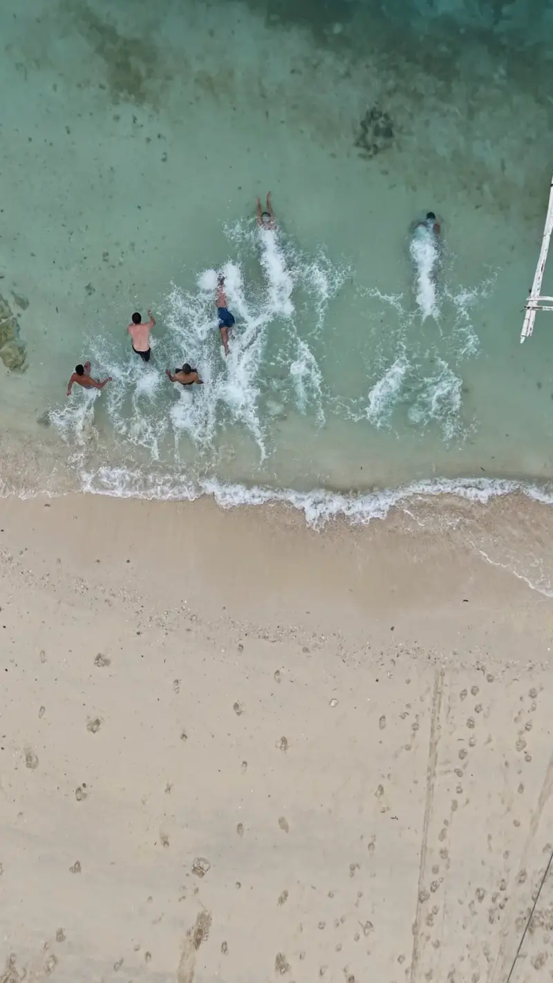 Drone view of guests splashing into the water from Virgin Island's beach